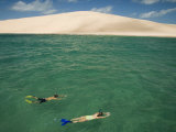 Snorkeling Alongside a Sandy Island Beach
