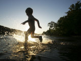 Young Boy Plays in the Shallows of the Potomac River  Maryland