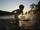Young Boy Plays in the Shallows of the Potomac River  Maryland