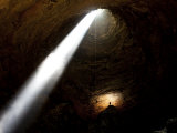 Caver after Rappellig the Entrance Drop of a 160-Foot-Deep Cave Pit