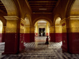 Girl Walking Through Building of Typical Burmese Architecture