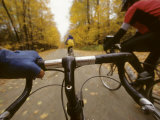 Bikers Ride Down a Country Road in the Fall