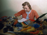 Woman Sorts Through Feathers and Fur to Be Used for Anglers' Flies
