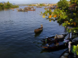 Fishing Boats Ply the Thu Bon River Near the Market at Hoi An