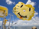 Parasail Operator Prepares Parachute for the Next Set of Tourists