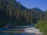Man Washes in a River in a Remote Location
