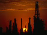 Oil Refinery Silhouetted During a Dramatic Sunset