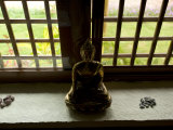 Gold Figurine Near a Window at the Indus Valley Ayurvedic Center