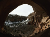Anasazi Dwellings in a Sandstone Cliff and View of Snowy Landscape