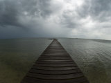 Storm Clouds over Horizon and Dock on the Gulf Coast