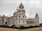 Man Walking Past Lord CurzonS Massive Victoria Memorial