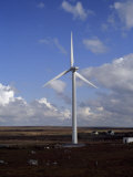 Wind Turbine under a Sky with Billowing Clouds