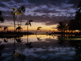 Sunset with Dramatic Clouds over a Hotel Pool Area