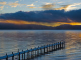 Snow Covered Pier on Lake Tahoe with Dramatic Sunrise Light