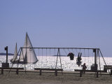 Sailboat and Kids on a Swing at a Playground at Sept-Iles  Quebec