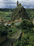 People Walk Road to Chapel Built Atop Tall Basalt Rock Formation