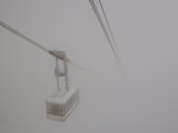 Cable Car Disappears into the Clouds Below Aiguille Du Midi