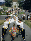 Morris Dancers Perform on a Village Street as Spectators Watch