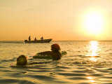 Sunset over the Caribbean Sea Play in the Water