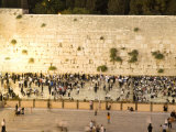 Jewish Men and Women Pray at the Western Wall at Night