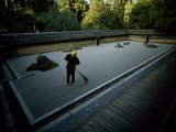 Men Rake the Famous Rock Garden at the Zen Ryoanji Temple