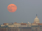Full Red Moon Rising over Buildings in the District of Columbia