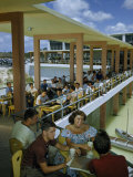 Students Relax at Tables on Covered Arcade of Student Center