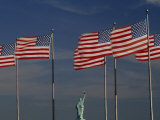 Back of the Statue of Liberty Is Seen Between American Flags
