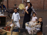 Mother and Children Stand Beside Luggage on Dock Awaiting Streamer