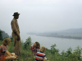 African American Man Talks to Caucasian Children Near Ohio River
