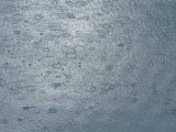 Raindrops Leaving an Abstract Pattern of Rings on Arctic Water