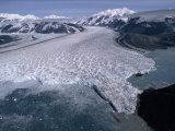 Aerial View of a Glacier and Nearby Mountains