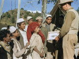 Western Scientist Shows a Painting of Himalayan Quail to Villagers