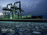 Ship Being Loaded with Cargo Containers at Twilight