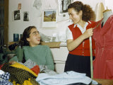 Young Dressmakers Share a Joke While Working