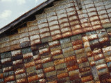 Side of a Building Adorned with Old License Plates