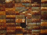 Side of a Building Adorned with Old License Plates