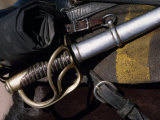 Close Up of a Sword Hilt and Scabbard Mounted on a Horse Saddle