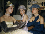Models Sit Behind the Scenes at a Haute Couture Fashion Salon