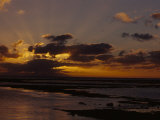 Scenic Tropical Sunset with Clouds and Crepuscular Rays of Sunlight