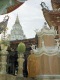 Monk Stands Beside Entrance to Seven-Tiered Pagoda
