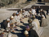 Sorters Hand-Pick Stigmas from Purple Saffron Flowers