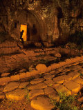 Man Peers Out from an Ancient Tomb in Falerii Novi  Italy