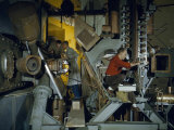 Technicians Adjust a Radio-Frequency System on a Cyclotron