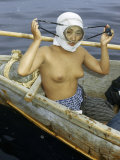 Diver for Seaweed Adjusts Her Face Mask