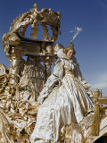 Young Circus Performer Dressed as Cinderella Rides an Ornate Float