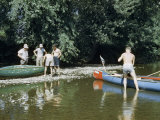 Men Stop to Repair Canoes Along Rocky Shallows of Susquehanna River