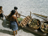 Women Unload Food for a Wedding Feast from an Outrigger Canoe