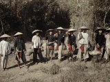 Large Sunshade Hats Protect These Men from the Tropic Sun