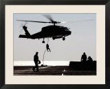 Personnel Fast-Rope out of an SH-60F Seahawk Helicopter